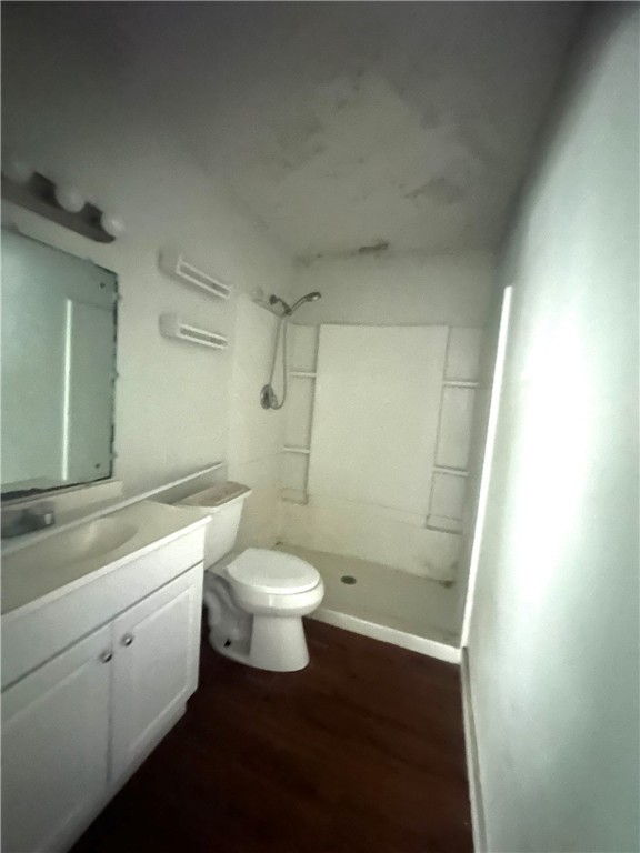 321 North Lee Street Mathis, TX 78368 - Photo 10 of 11 a bathroom with a toilet sink a shower and vanity