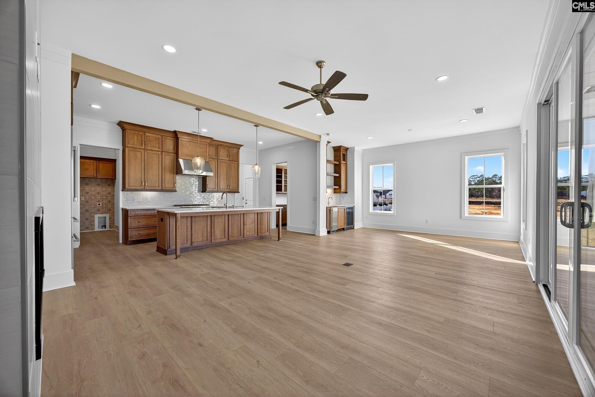 1318 Long Grove Way Lexington, SC 29072 - Photo 14 of 90 a view of a big room with wooden floor and windows