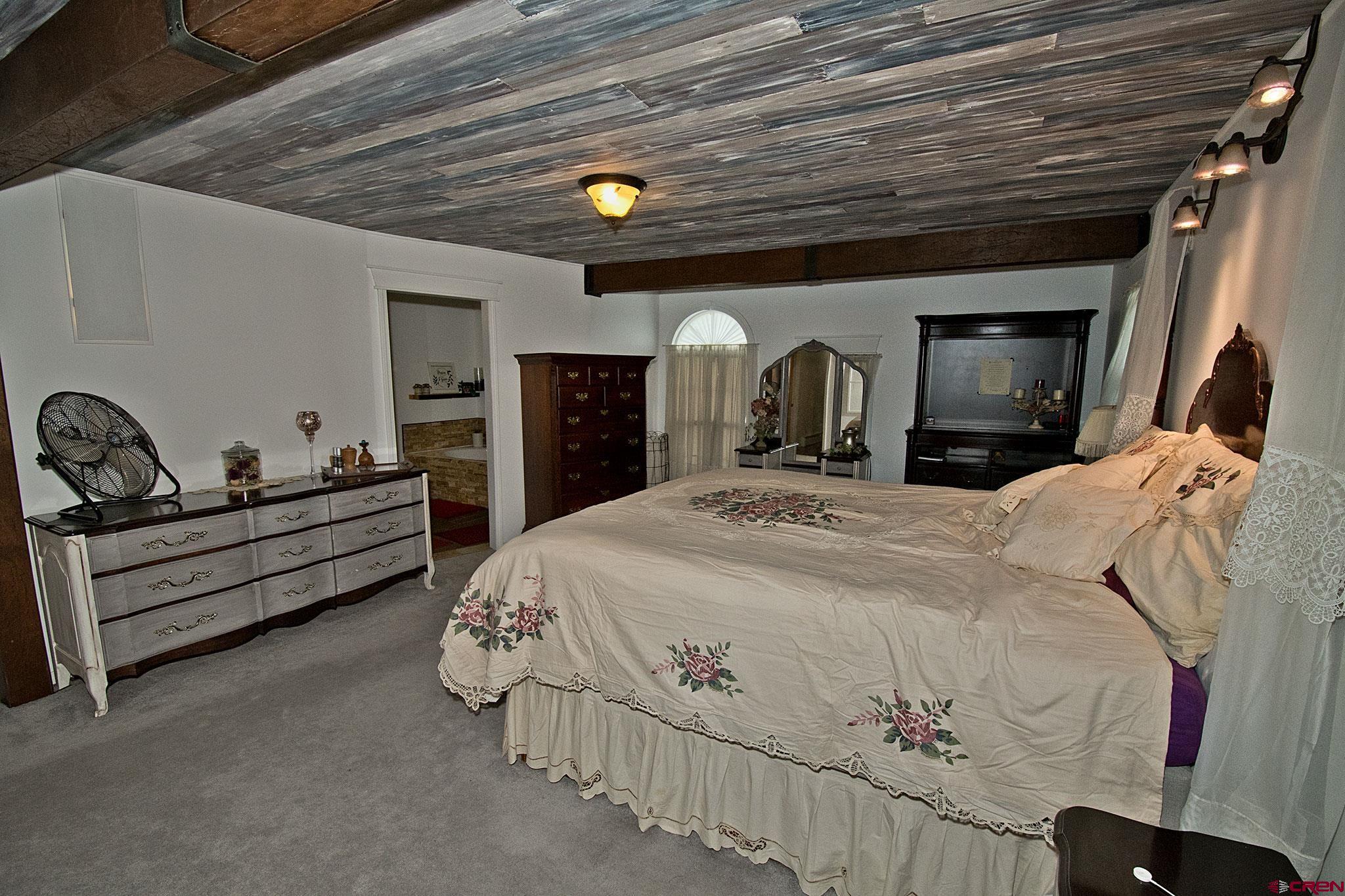 808 Weber Drive Alamosa, CO 81101 - Photo 23 of 44 a bed room with a bed and a tv
