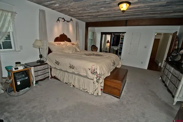 a bed room with a bed and a tv