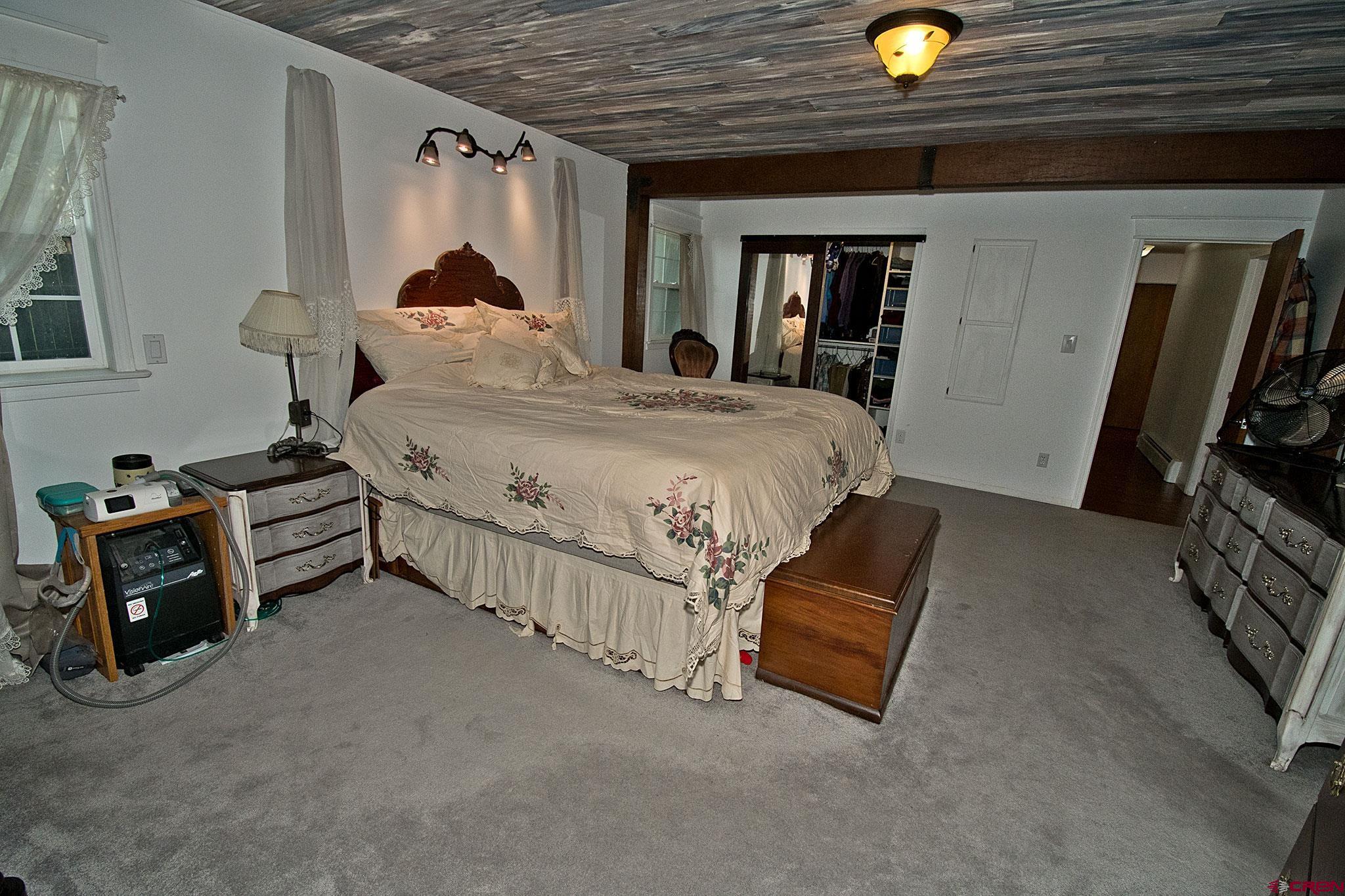 808 Weber Drive Alamosa, CO 81101 - Photo 24 of 44 a bed room with a bed and a tv