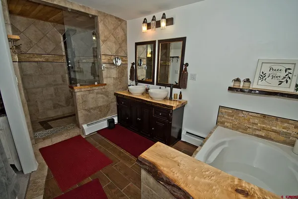 a bedroom with a bed and a mirror