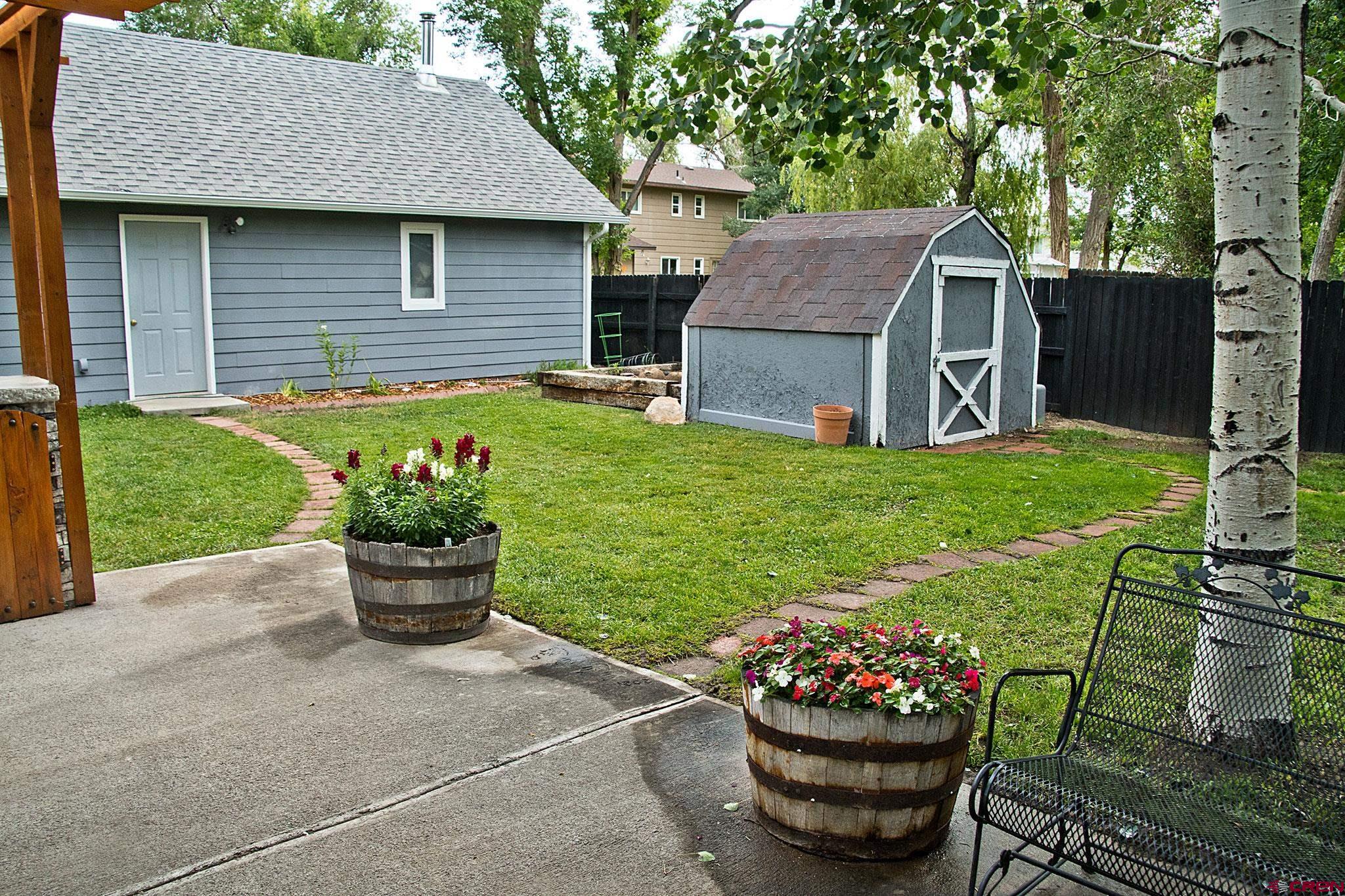 808 Weber Drive Alamosa, CO 81101 - Photo 39 of 44 a front view of a house with a garden
