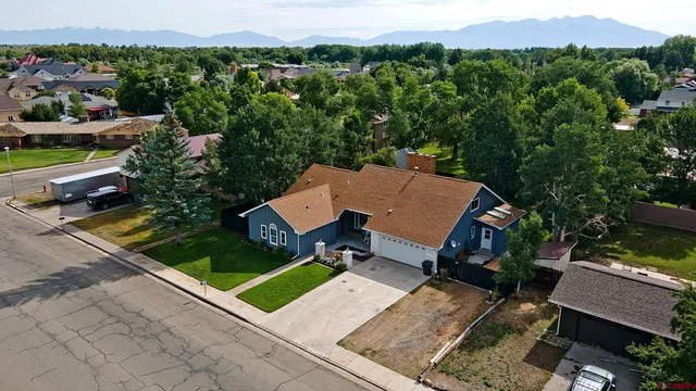 an aerial view of a house with outdoor space