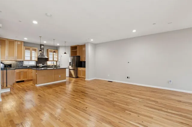 a view of kitchen with wooden floor