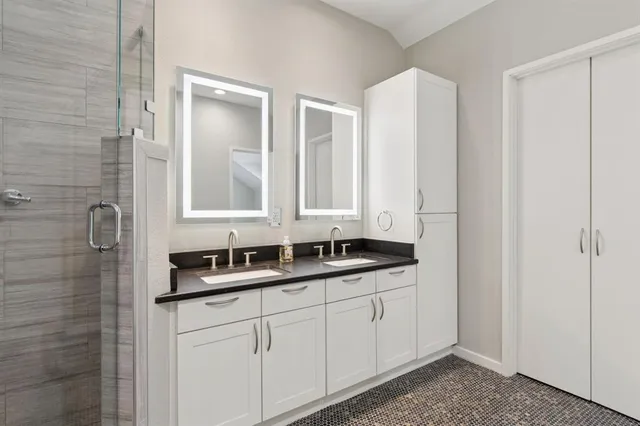 an empty room with windows and closet