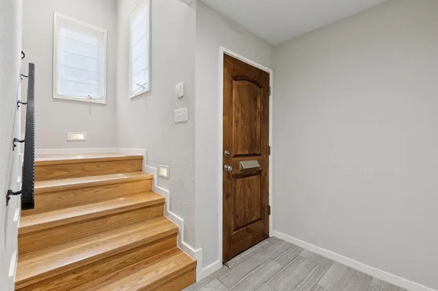 a view of entryway with wooden floor