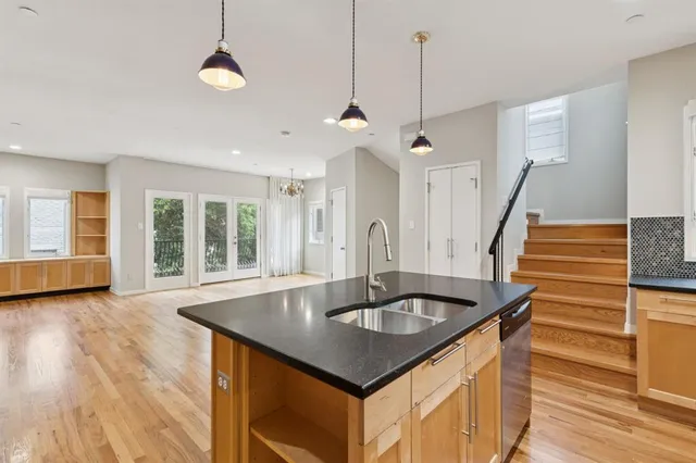 a kitchen with sink and center island