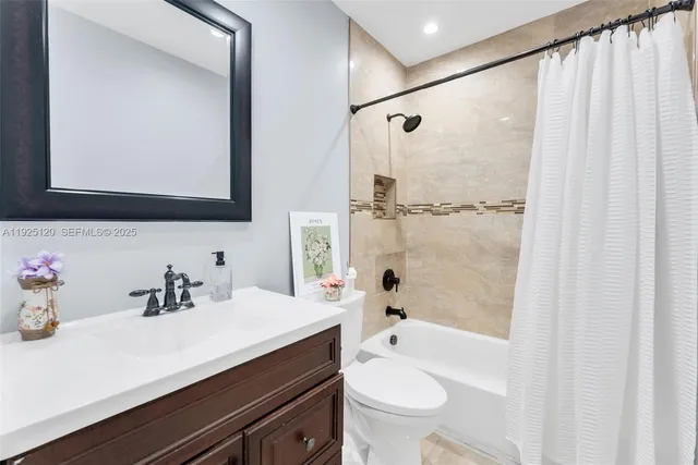 a bathroom with a sink a toilet and a bathtub