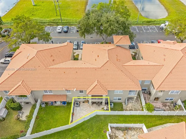 an aerial view of a house with a garden