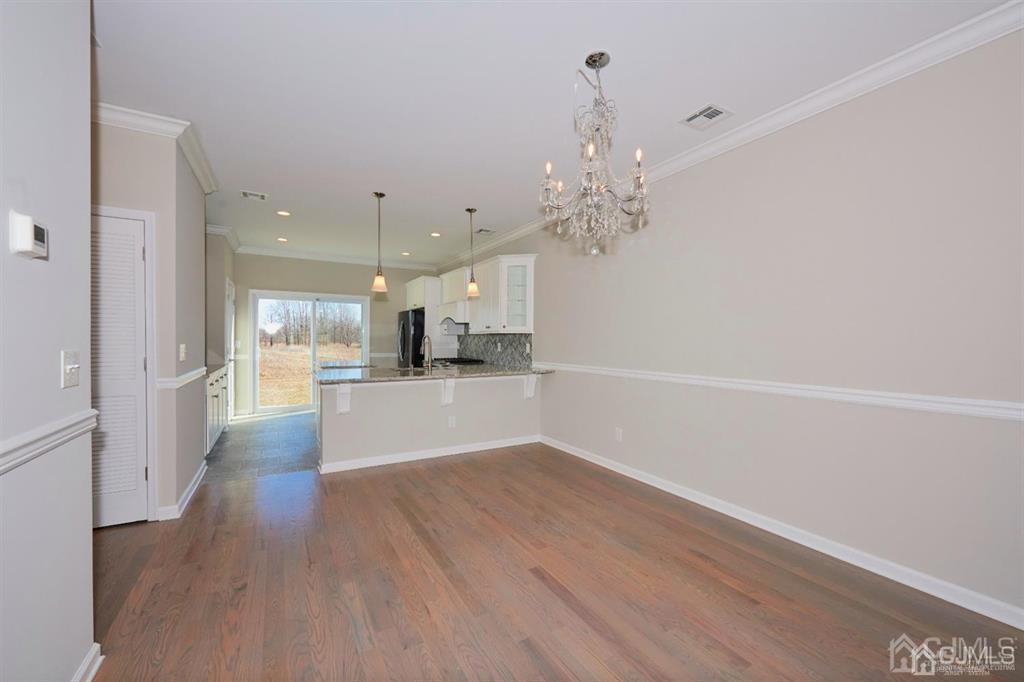22 Green Tree Circle Hazlet, NJ 07730 - Photo 11 of 39 a view of a kitchen with cabinets and wooden floor