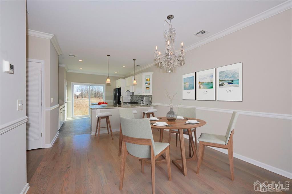 22 Green Tree Circle Hazlet, NJ 07730 - Photo 12 of 39 a view of a dining room with furniture and chandelier