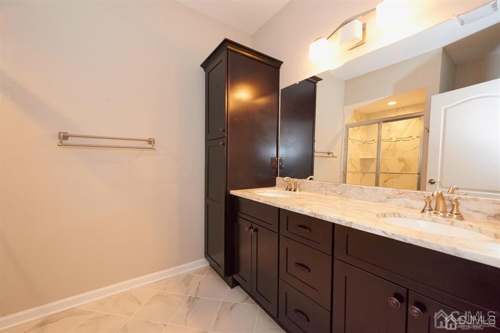 22 Green Tree Circle Hazlet, NJ 07730 - Photo 16 of 39 a bathroom with a granite countertop sink and a mirror