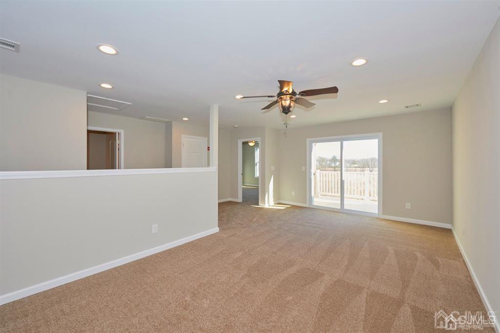 22 Green Tree Circle Hazlet, NJ 07730 - Photo 22 of 39 a view of an empty room with a window