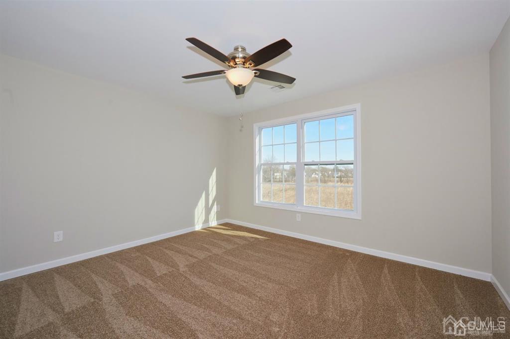 22 Green Tree Circle Hazlet, NJ 07730 - Photo 23 of 39 a view of empty room with ceiling fan