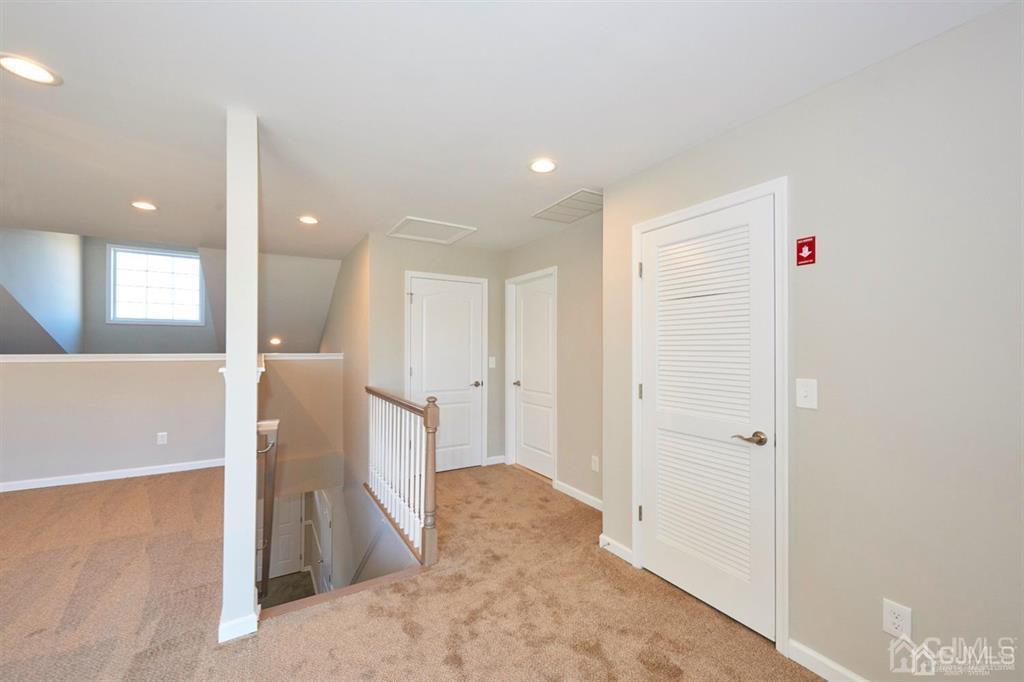 22 Green Tree Circle Hazlet, NJ 07730 - Photo 27 of 39 a view of a hallway with bathroom