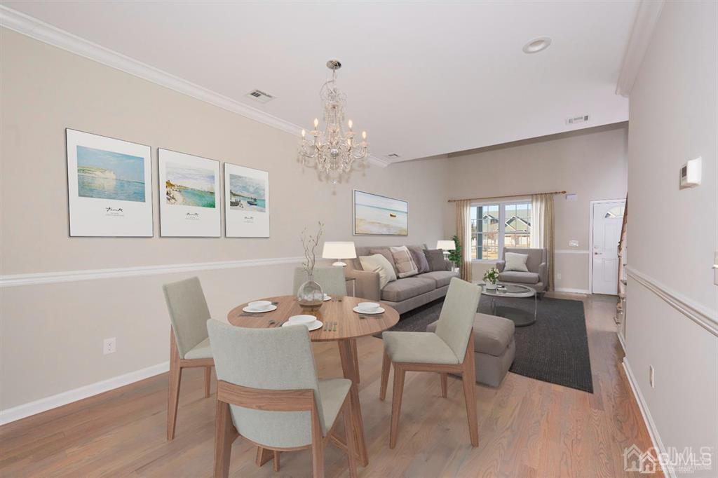 22 Green Tree Circle Hazlet, NJ 07730 - Photo 10 of 39 a dining room with furniture a livingroom view and a chandelier