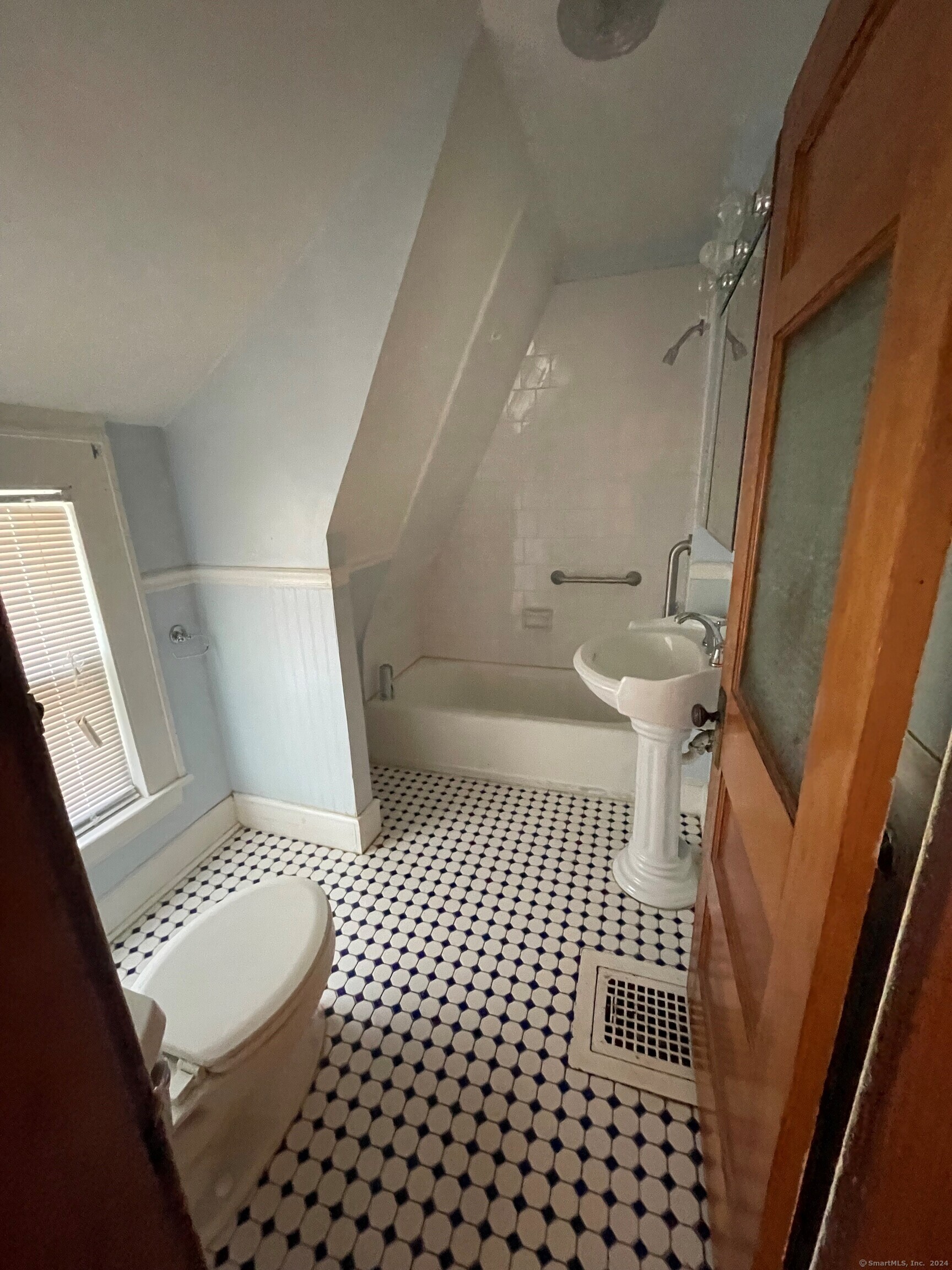 22 Fairview Street Milford, CT 06460 - Photo 17 of 28 a bathroom with a sink a toilet and a shower