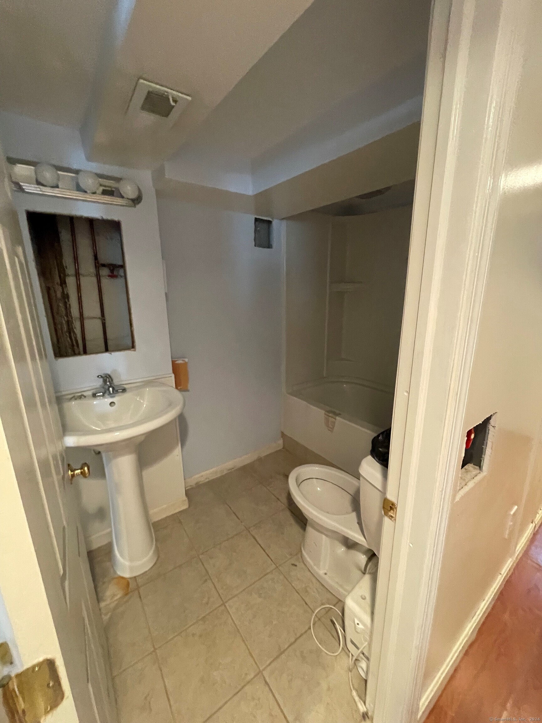 22 Fairview Street Milford, CT 06460 - Photo 25 of 28 a bathroom with a sink toilet and shower
