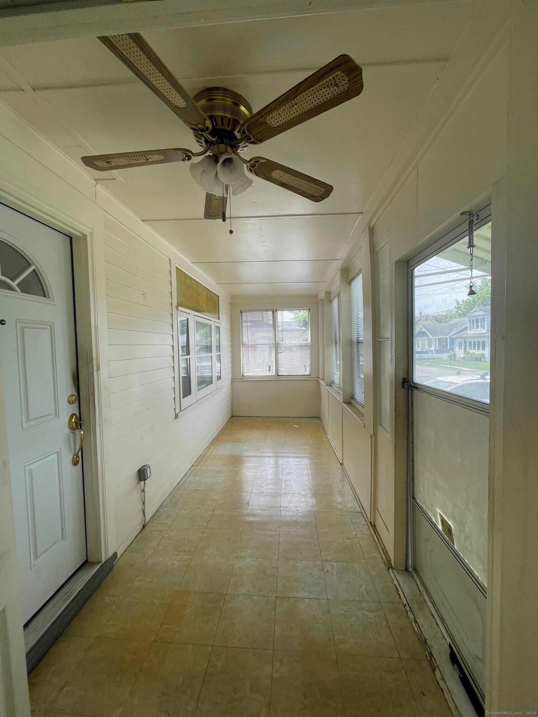 22 Fairview Street Milford, CT 06460 - Photo 26 of 28 en empty room with windows and ceiling fan