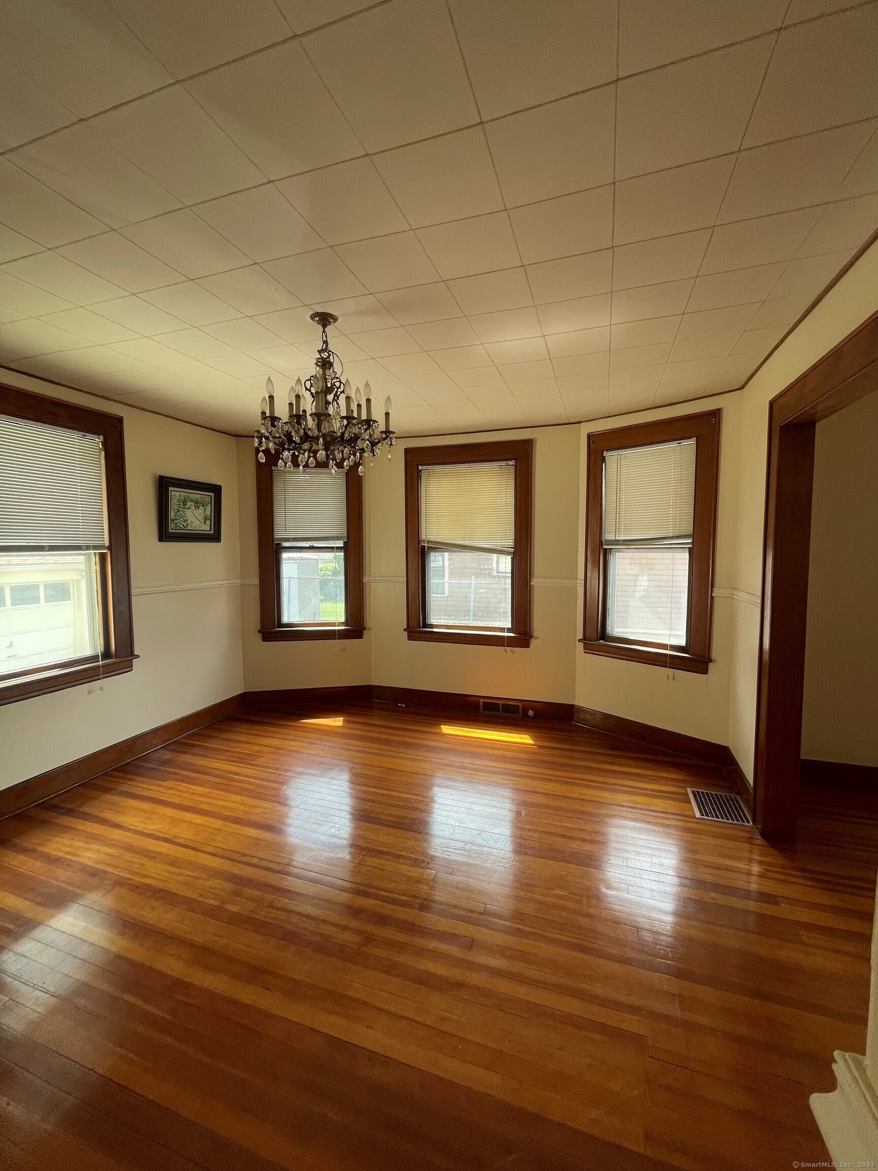 22 Fairview Street Milford, CT 06460 - Photo 4 of 28 a view of livingroom with window and hardwood floor