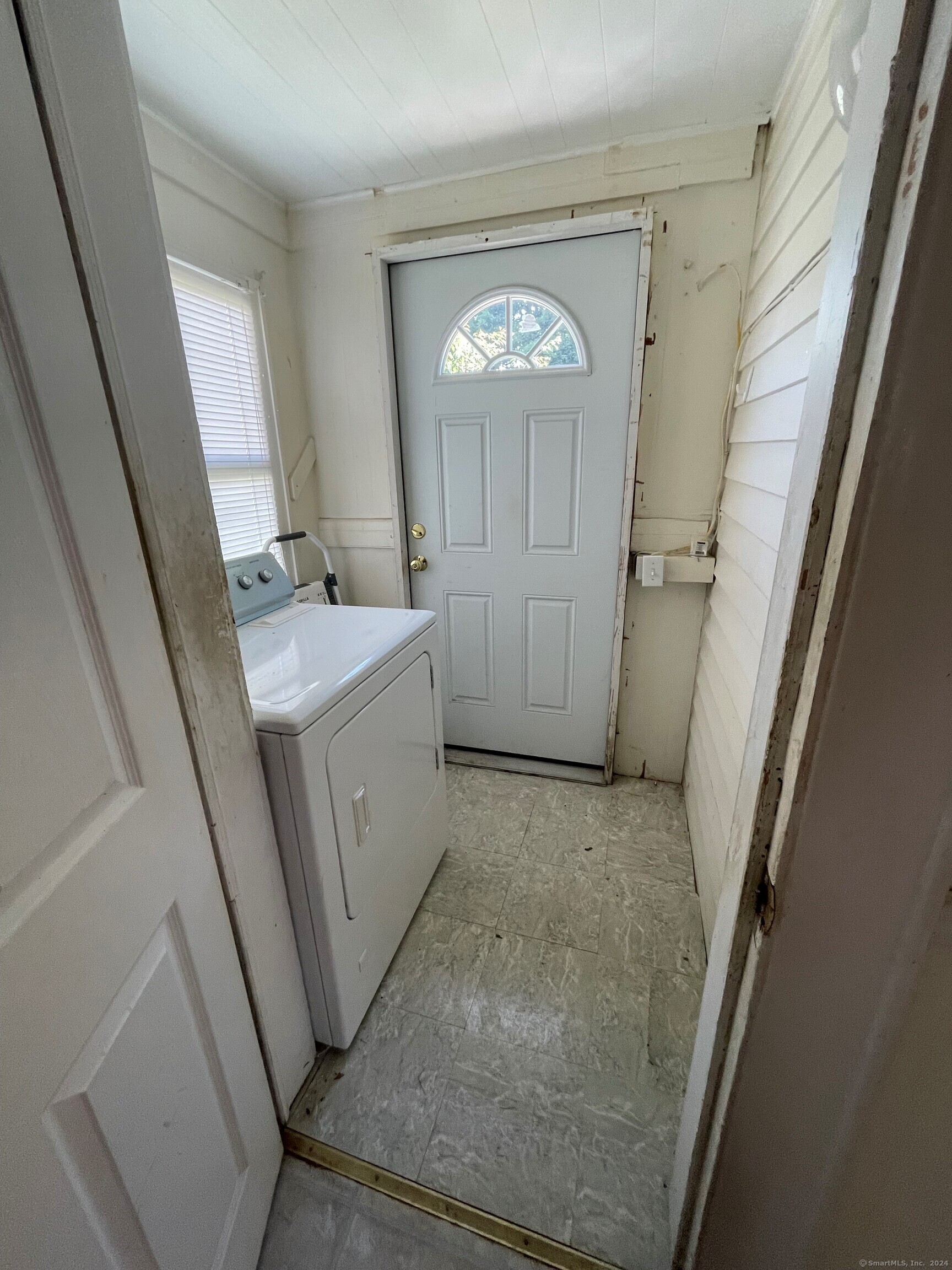 22 Fairview Street Milford, CT 06460 - Photo 9 of 28 a view of a hallway with washer and dryer