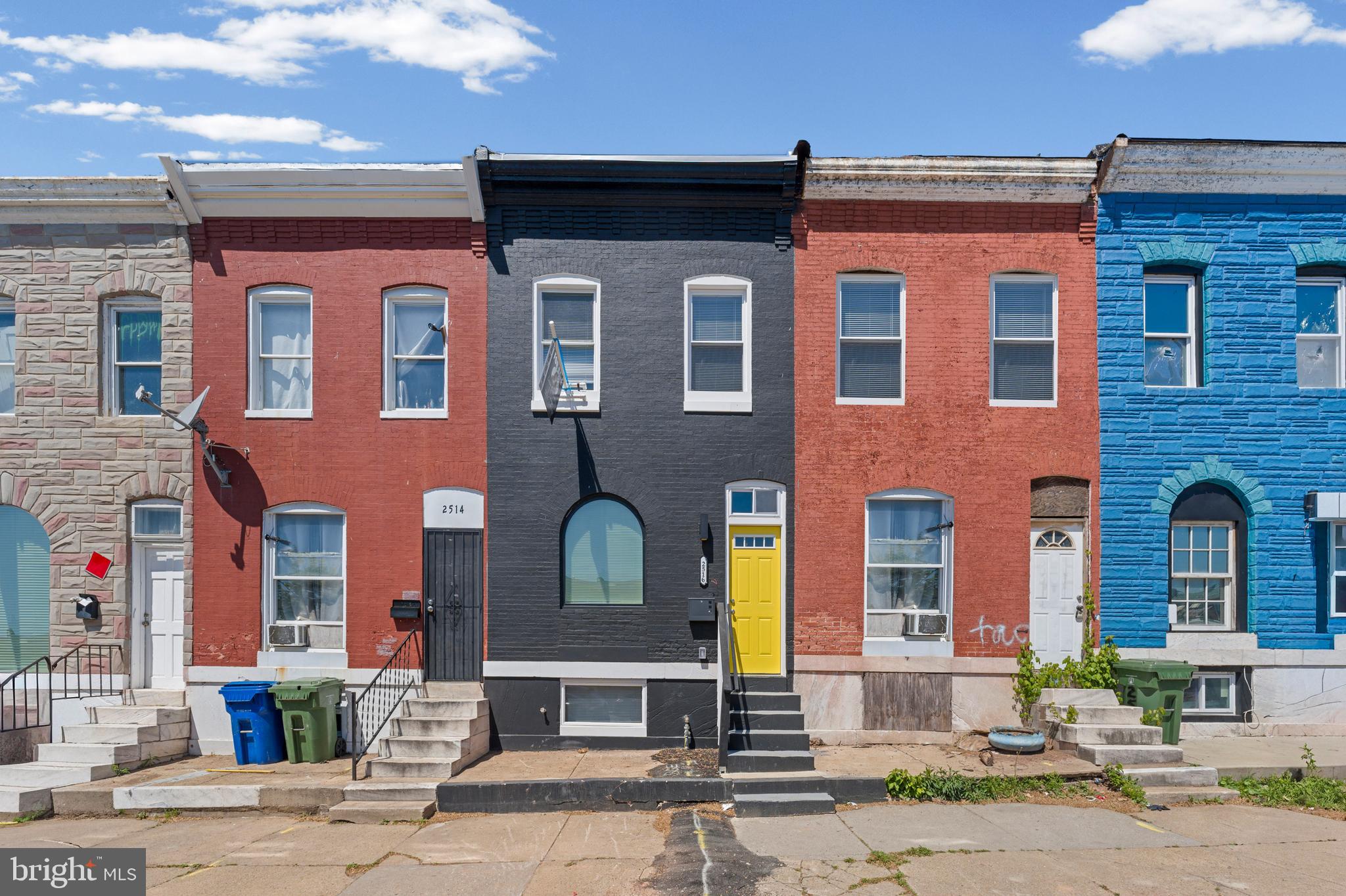 2516 Federal Street Baltimore, MD 21213 - Photo 35 of 40 a front view of a house with a yard