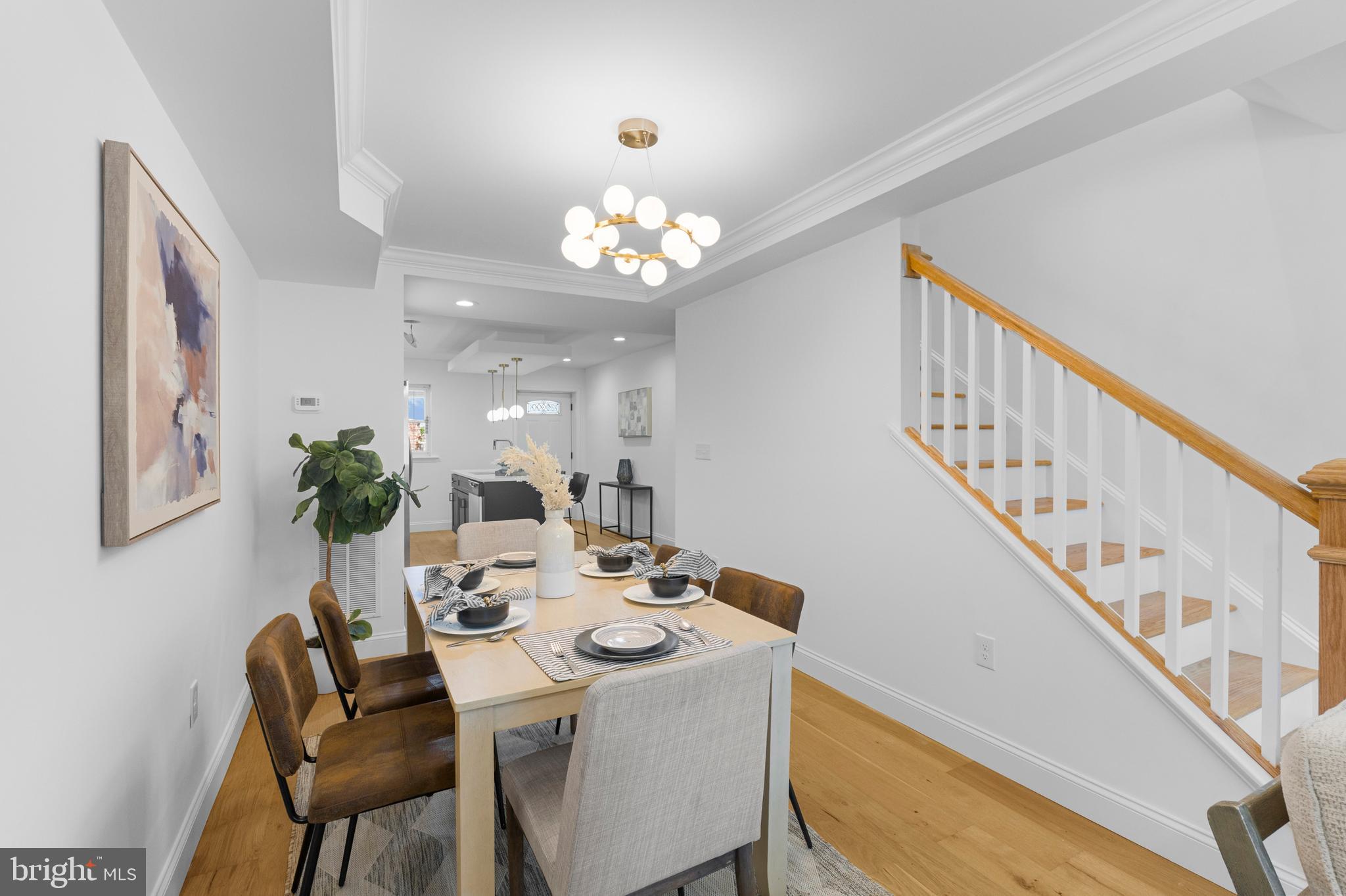 2516 Federal Street Baltimore, MD 21213 - Photo 4 of 40 a view of a dining room with furniture and a chandelier