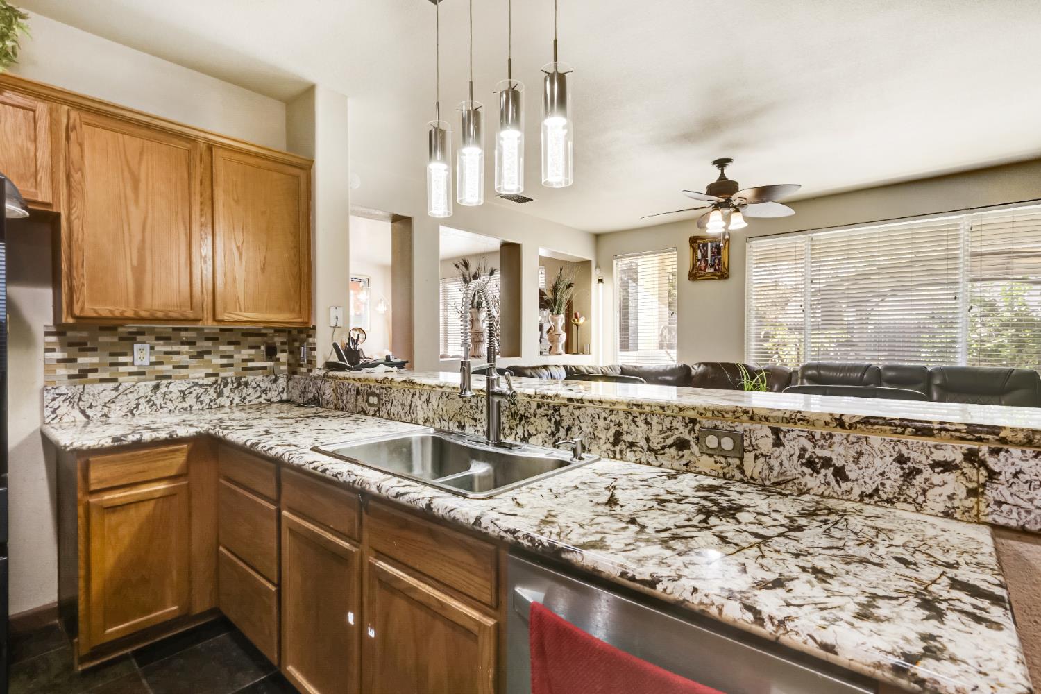 9820 Spring View Way Elk Grove, CA 95757 - Photo 20 of 49 a kitchen with a sink and a stove