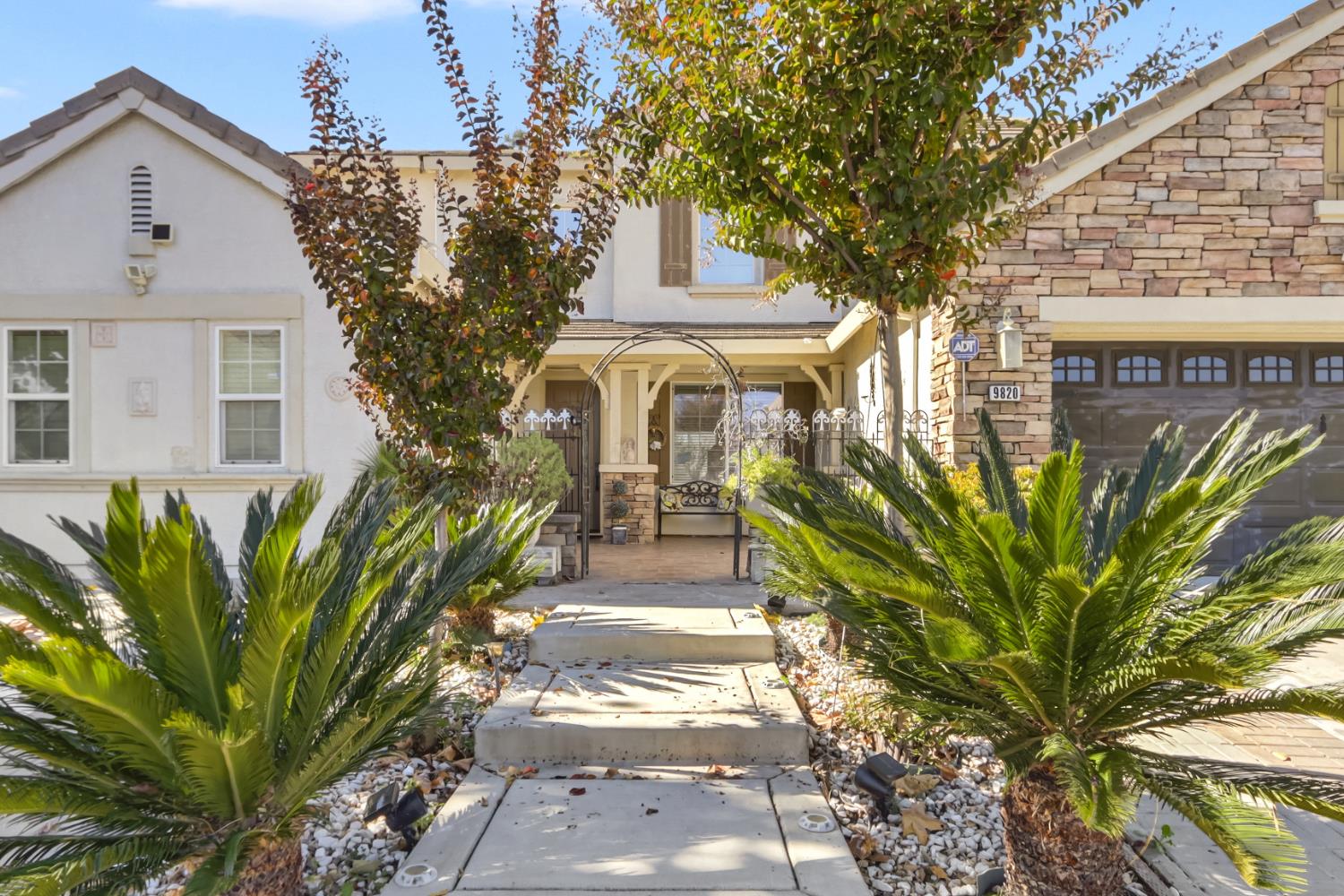 9820 Spring View Way Elk Grove, CA 95757 - Photo 2 of 49 a front view of a house with a garden