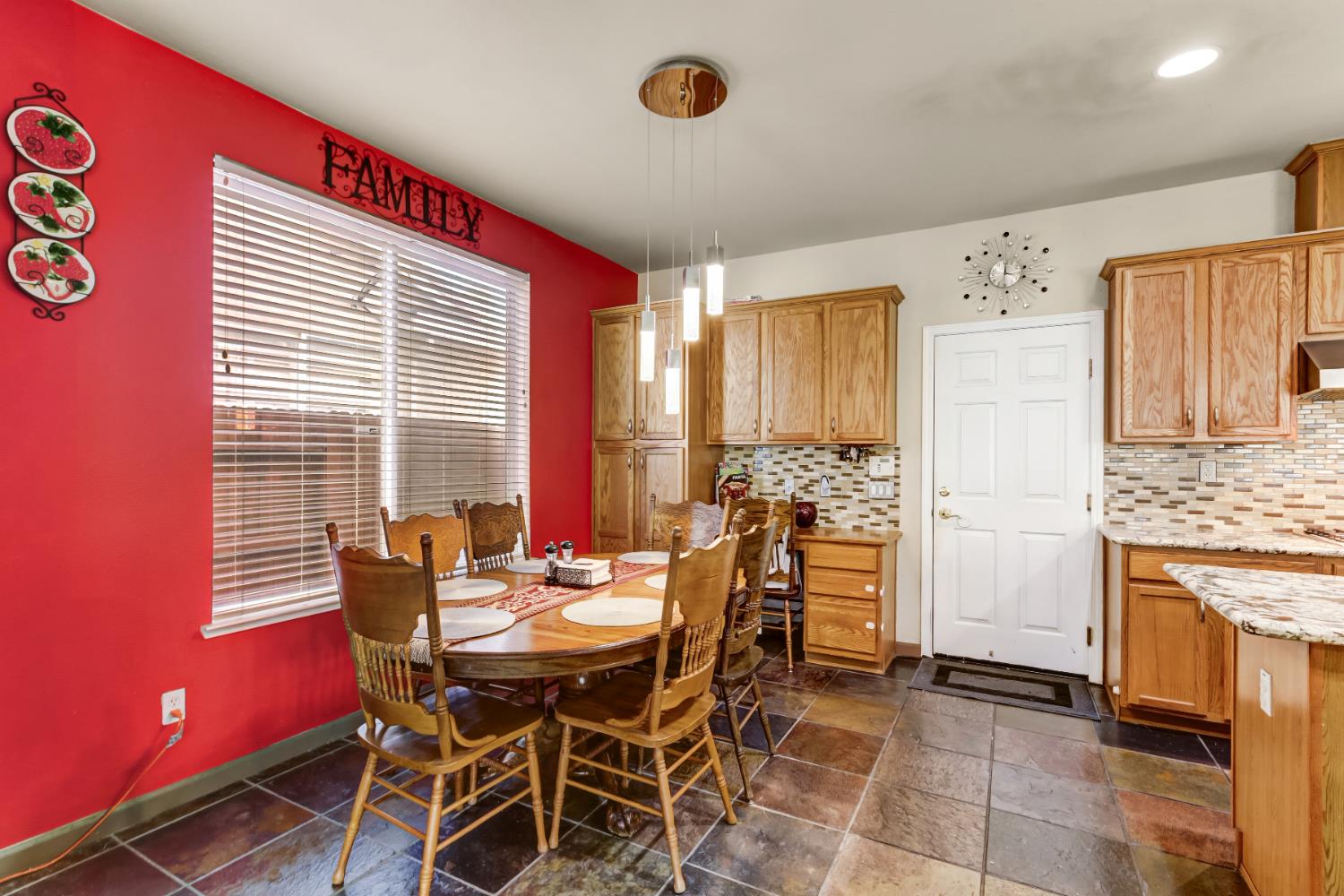 9820 Spring View Way Elk Grove, CA 95757 - Photo 23 of 49 a dining room with furniture and window