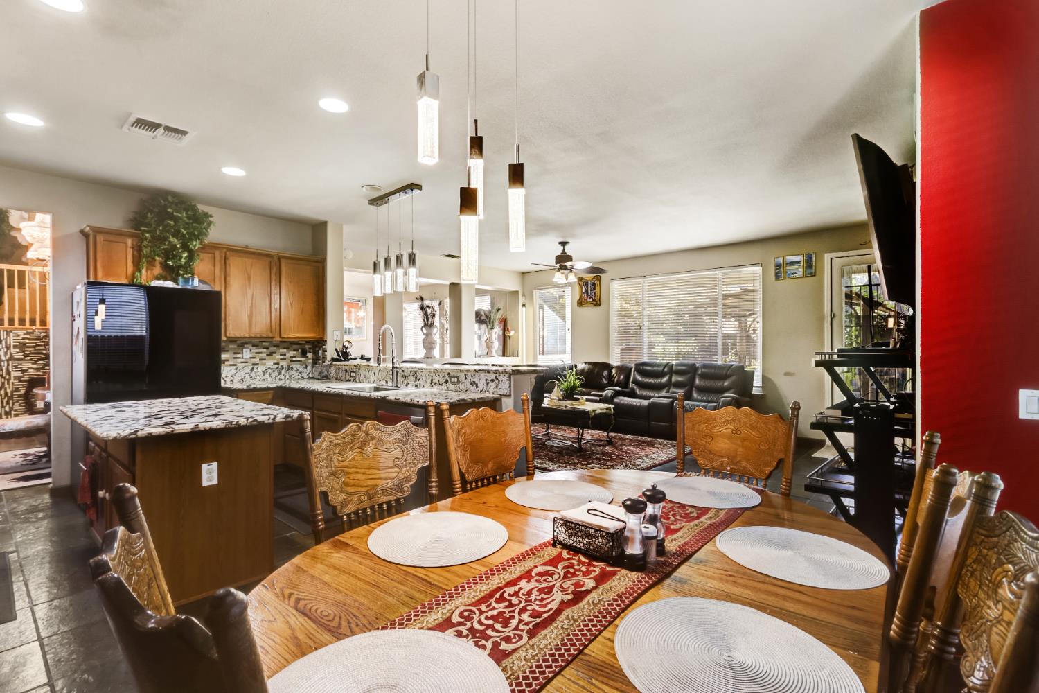 9820 Spring View Way Elk Grove, CA 95757 - Photo 24 of 49 a living room with granite countertop couches a coffee table and chairs with wooden floor