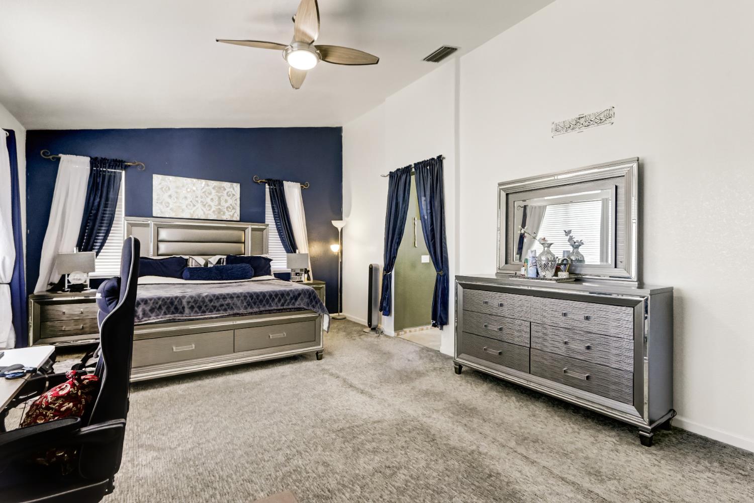 9820 Spring View Way Elk Grove, CA 95757 - Photo 30 of 49 a bedroom with bed and ceiling fan