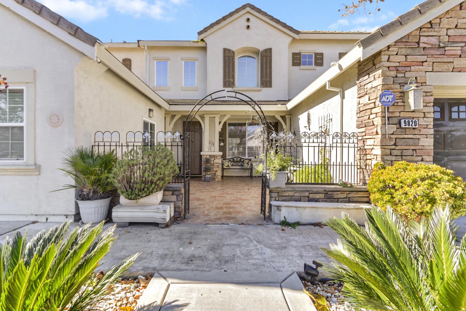 9820 Spring View Way Elk Grove, CA 95757 - Photo 3 of 49 a front view of a house with a garden