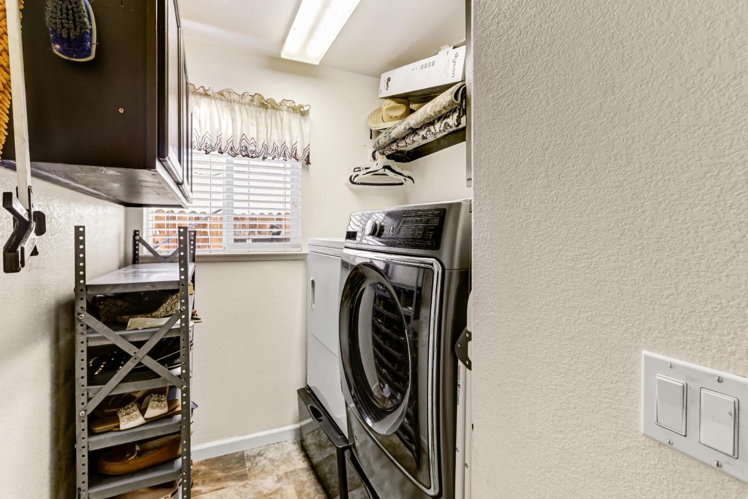 9820 Spring View Way Elk Grove, CA 95757 - Photo 44 of 49 a utility room with sink dryer and washer
