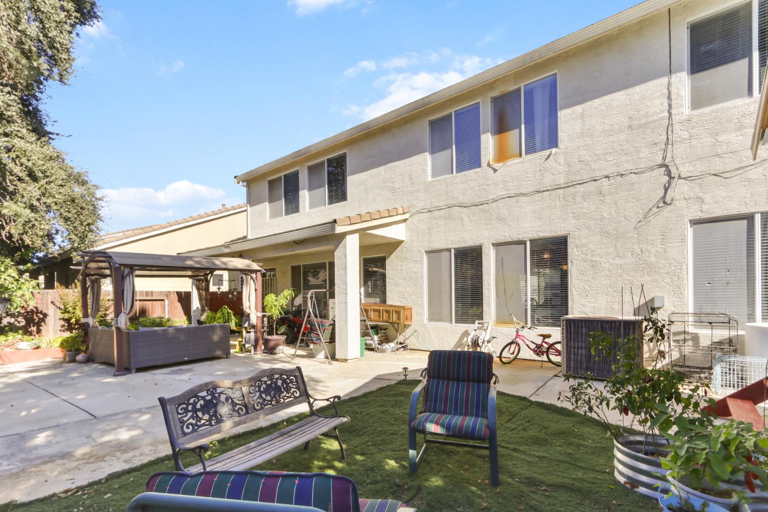 9820 Spring View Way Elk Grove, CA 95757 - Photo 46 of 49 a front view of a house with outdoor seating
