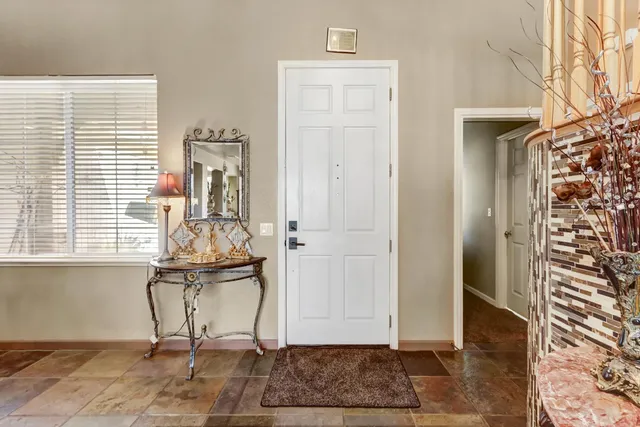 a view of a livingroom with wooden floor and a window