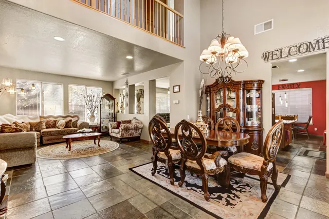 a living room with lots of chairs and couches
