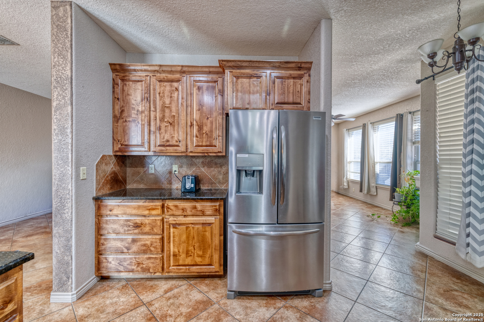 3 Briar Court Uvalde, TX 78801 - Photo 16 of 27 a kitchen with stainless steel appliances granite countertop a refrigerator and a stove