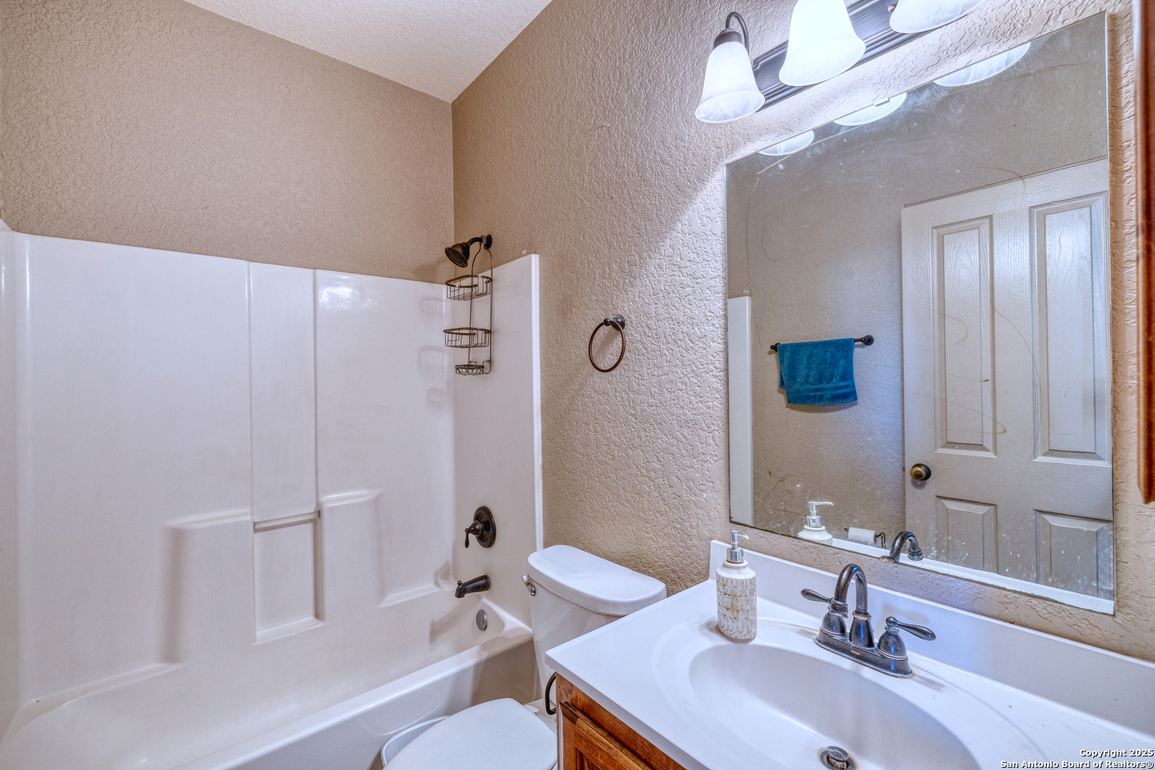 3 Briar Court Uvalde, TX 78801 - Photo 19 of 27 a bathroom with a sink a toilet and shower