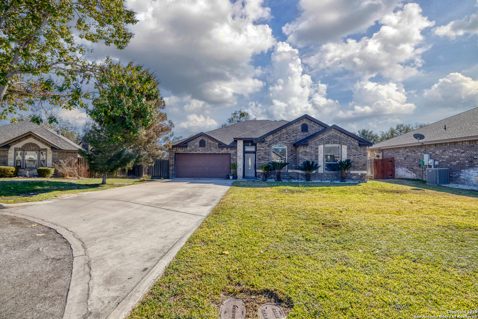 3 Briar Court Uvalde, TX 78801 - Photo 2 of 27 a front view of house with yard and swimming pool