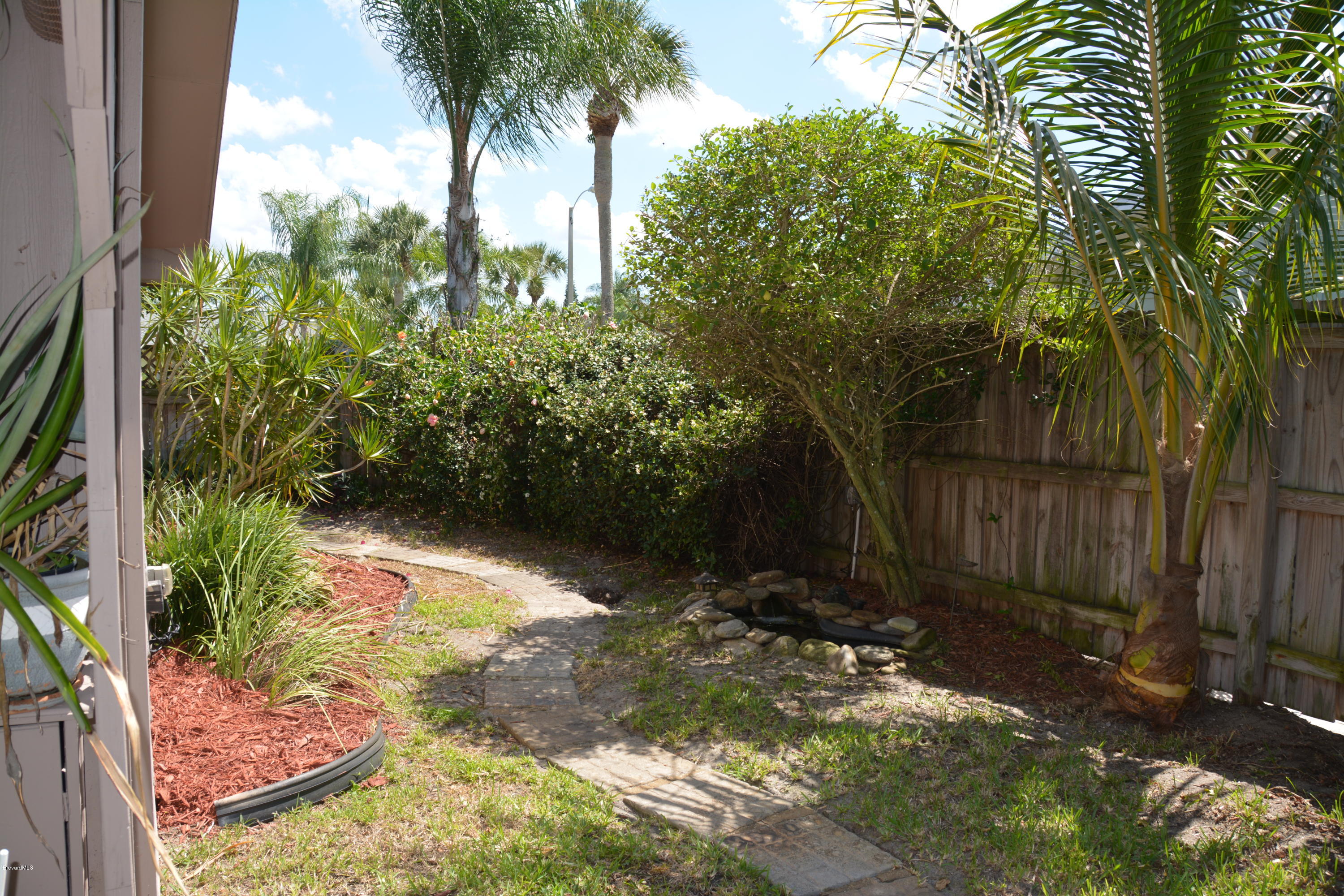 148 Sand Pine Road Indialantic, FL 32903 - Photo 26 of 46 South Gardens & Koi Pond
