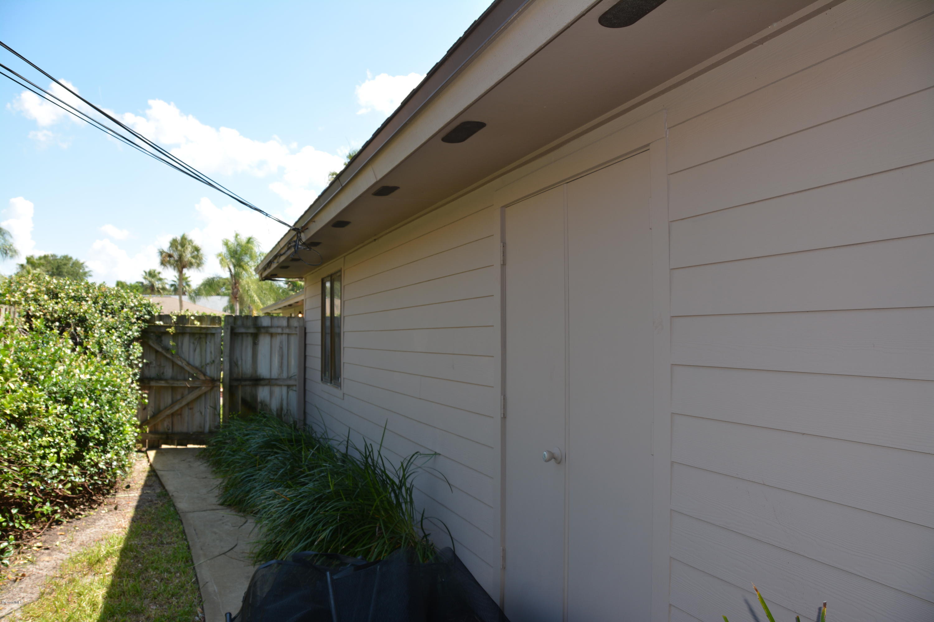 148 Sand Pine Road Indialantic, FL 32903 - Photo 34 of 46 Built-in Shed Storage Room