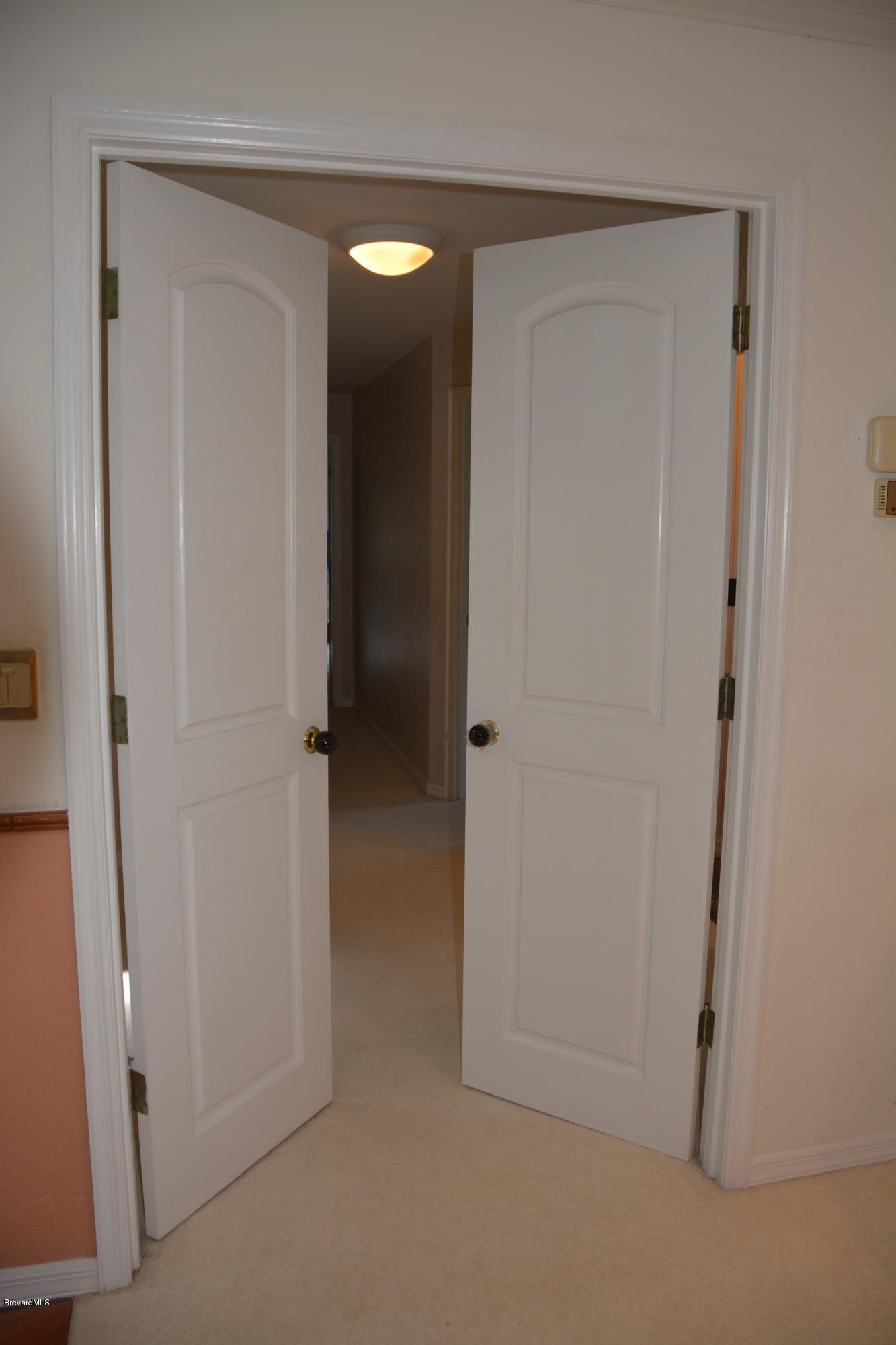 148 Sand Pine Road Indialantic, FL 32903 - Photo 44 of 46 French Doors to North Wing bedrooms
