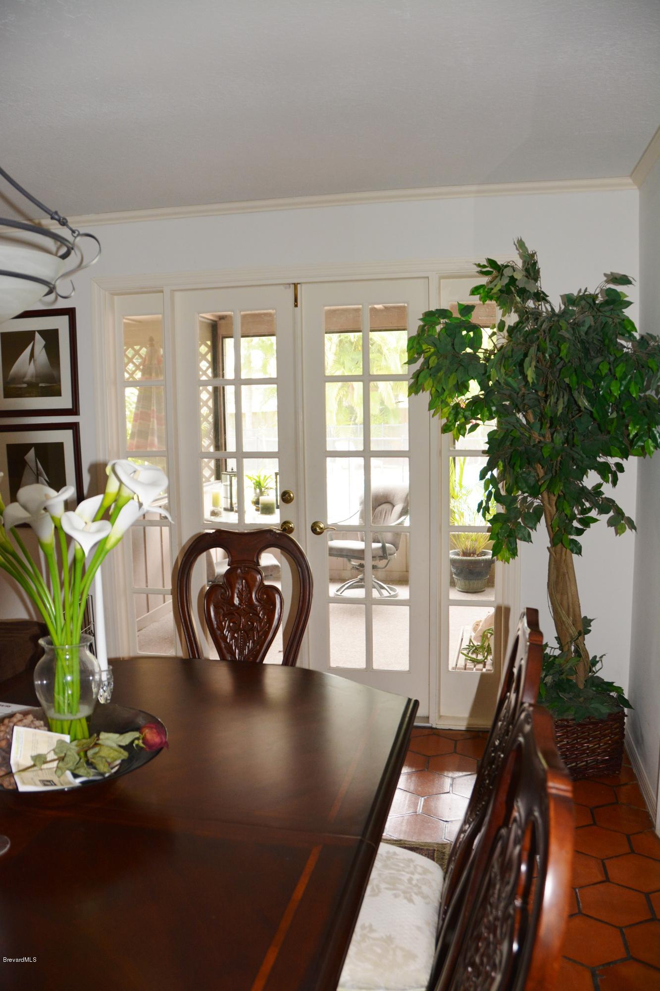 148 Sand Pine Road Indialantic, FL 32903 - Photo 7 of 46 Dining with a pool view