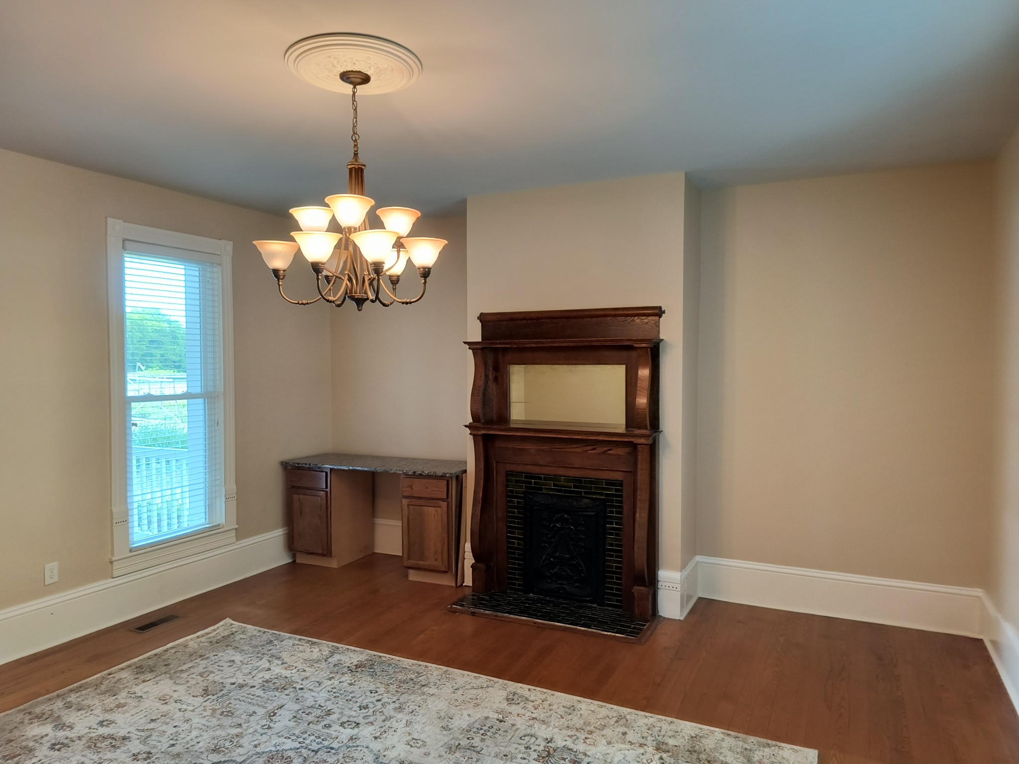 3460 Big Springs Road Lebanon, TN 37090 - Photo 9 of 74 a view of a livingroom with a fireplace a chandelier and wooden floor