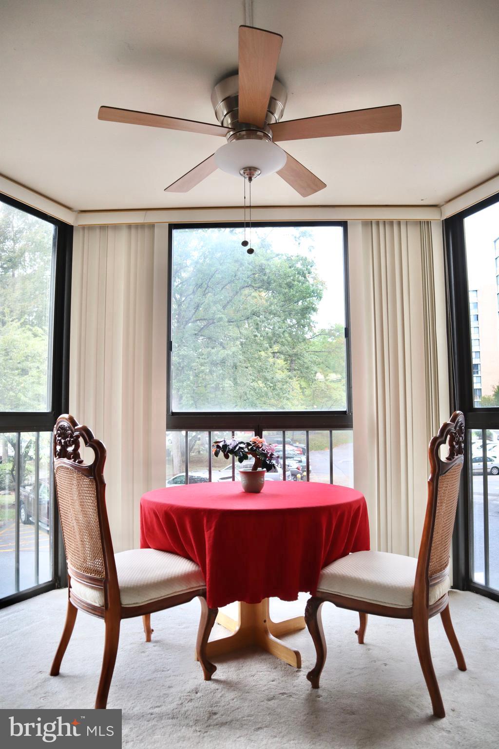 15107 Interlachen Drive, Unit 2119 Silver Spring, MD 20906 - Photo 15 of 53 a view of a dining room with furniture window and outside view