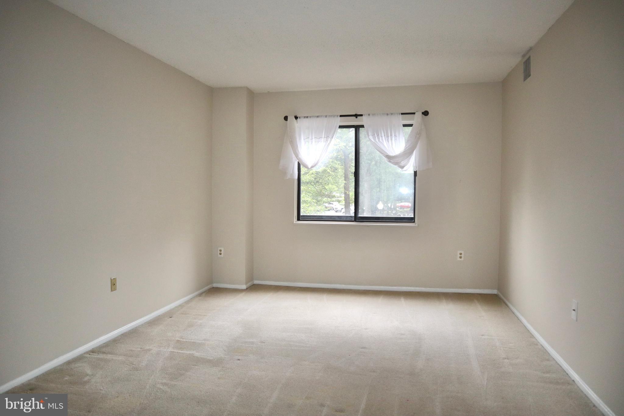15107 Interlachen Drive, Unit 2119 Silver Spring, MD 20906 - Photo 16 of 53 an empty room with windows