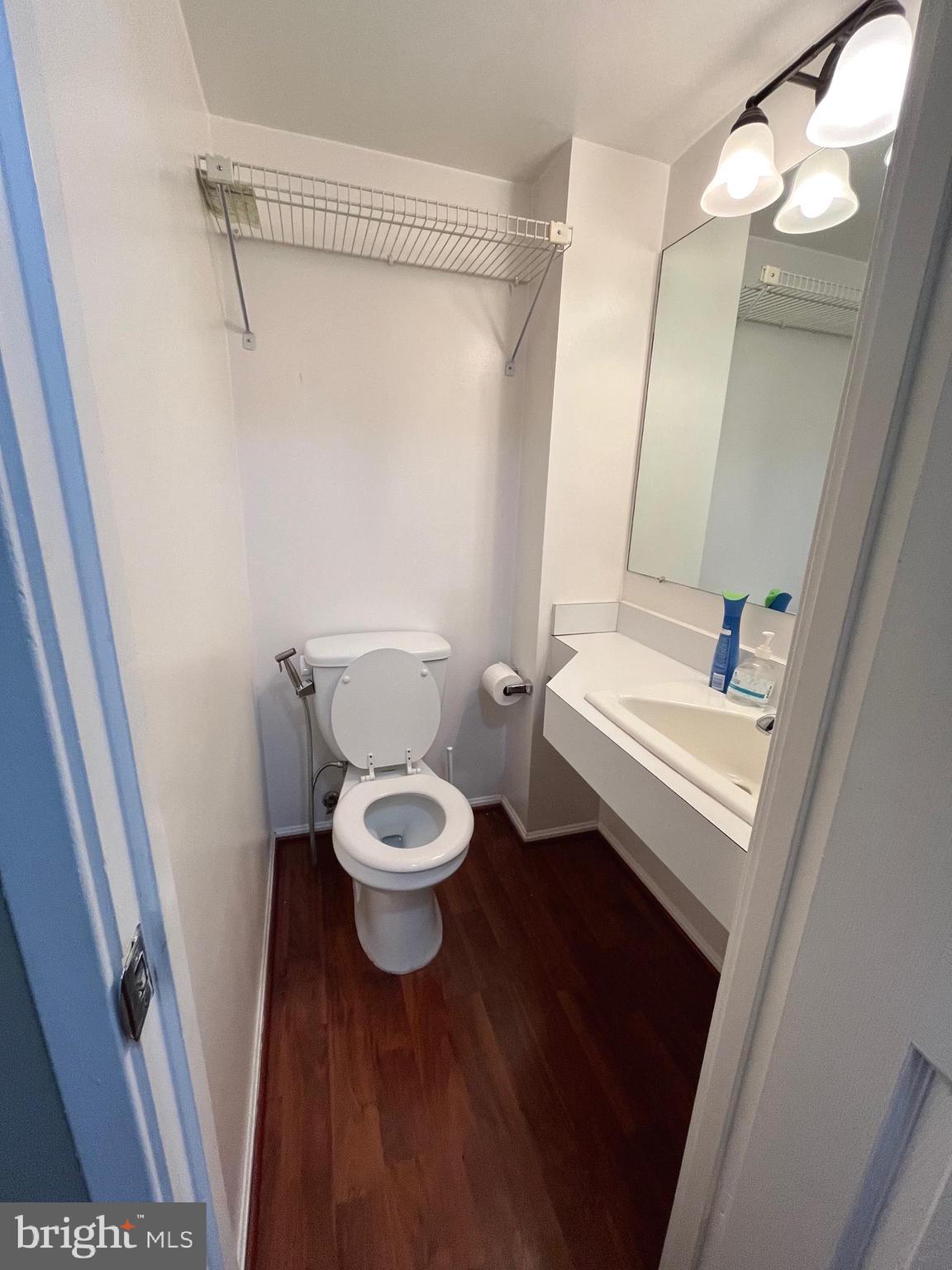 15107 Interlachen Drive, Unit 2119 Silver Spring, MD 20906 - Photo 21 of 53 a white toilet sitting next to a bathroom sink