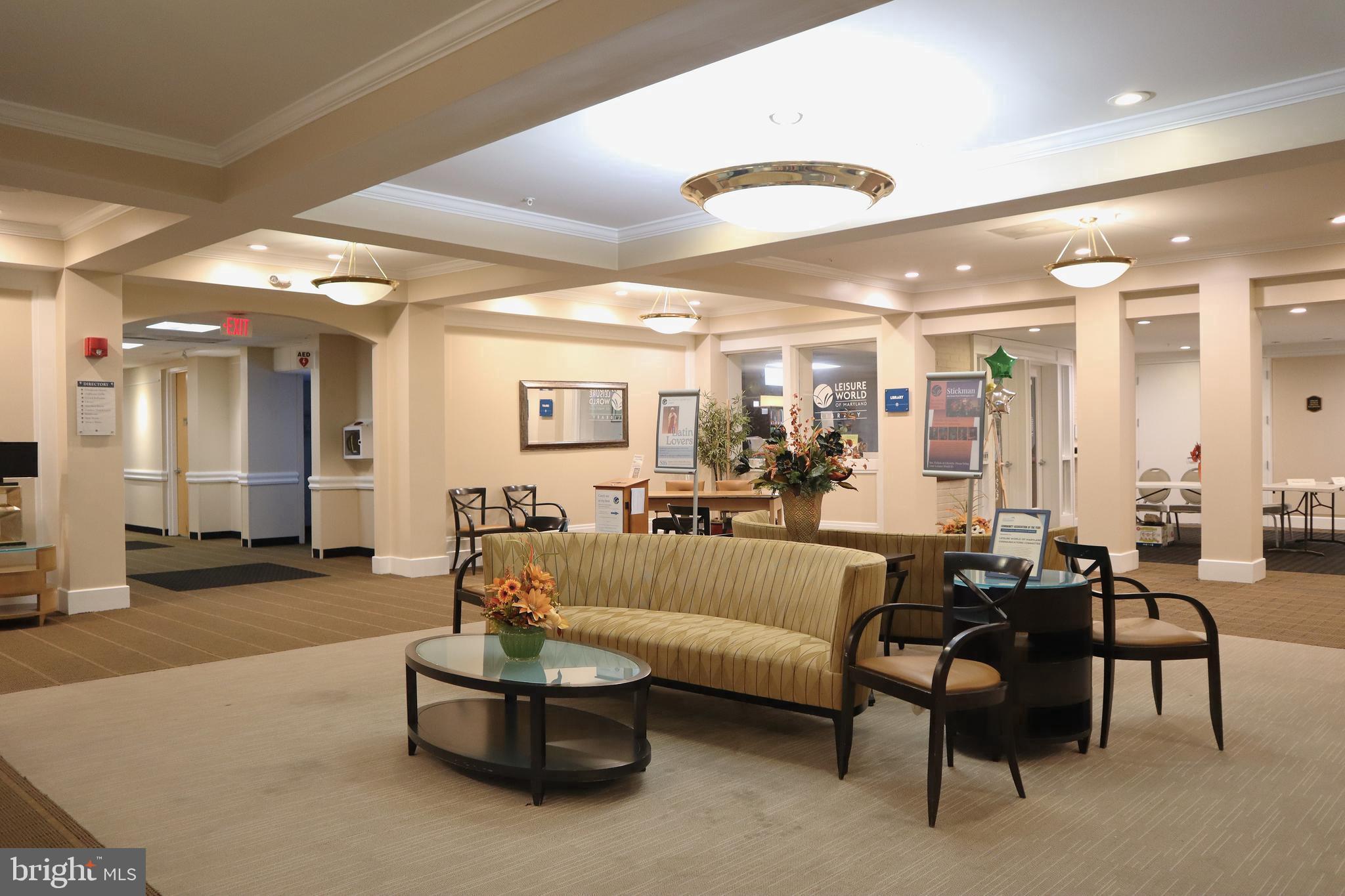 15107 Interlachen Drive, Unit 2119 Silver Spring, MD 20906 - Photo 28 of 53 a living room with furniture and a large window